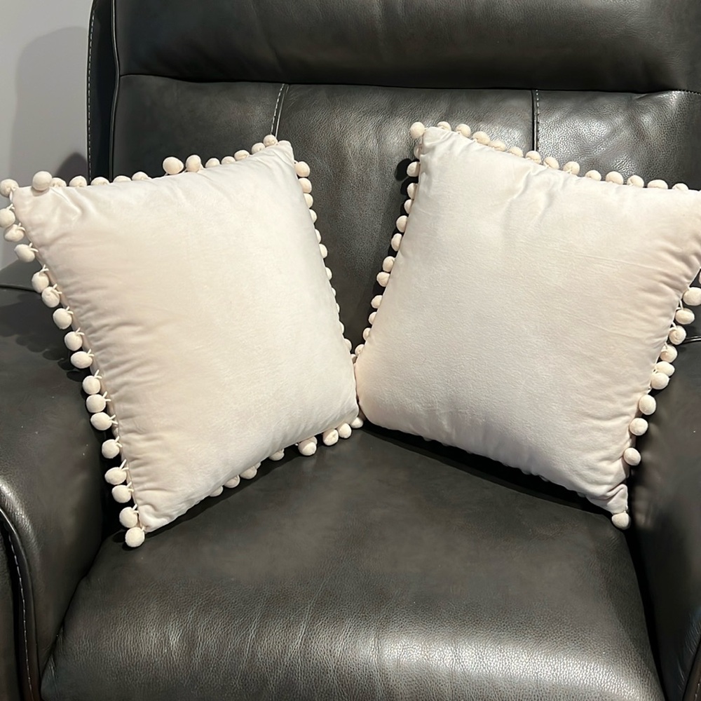 Pair of cream colored Pom Pom pillows